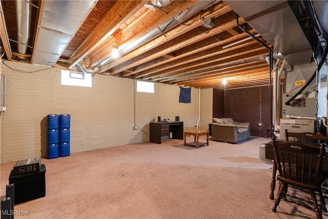 3602 Marvin Ave, Cleveland, OH 44109 - below grade area with carpet, brick wall, and heating unit