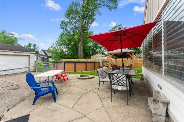79 Leighton Ave, Youngstown, OH 44512 - view of patio / terrace with an outdoor fire pit, outdoor dining area, a fenced backyard, and a gazebo