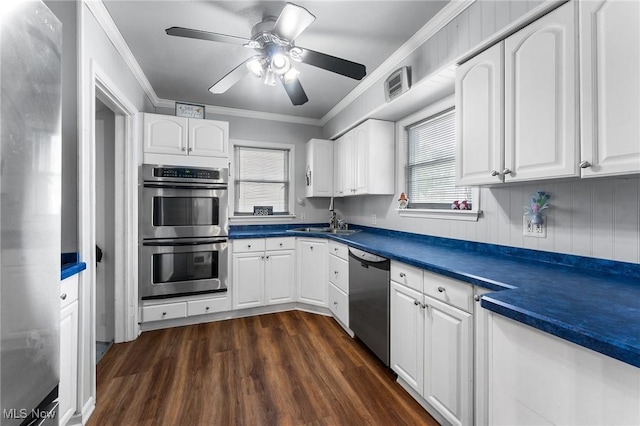79 Leighton Ave, Youngstown, OH 44512 - kitchen with appliances with stainless steel finishes, dark wood-style floors, ceiling fan, white cabinetry, and dark countertops