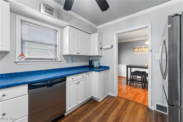 79 Leighton Ave, Youngstown, OH 44512 - kitchen featuring stainless steel appliances, crown molding, dark wood-type flooring, dark countertops, and white cabinets