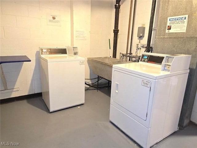 16100 Van Aken Blvd, Shaker Heights, OH 44120 - community laundry featuring independent washer and dryer and concrete block wall