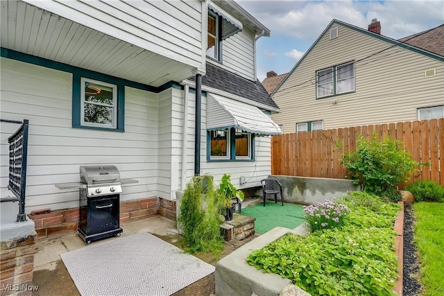 view of patio featuring fence and grilling area