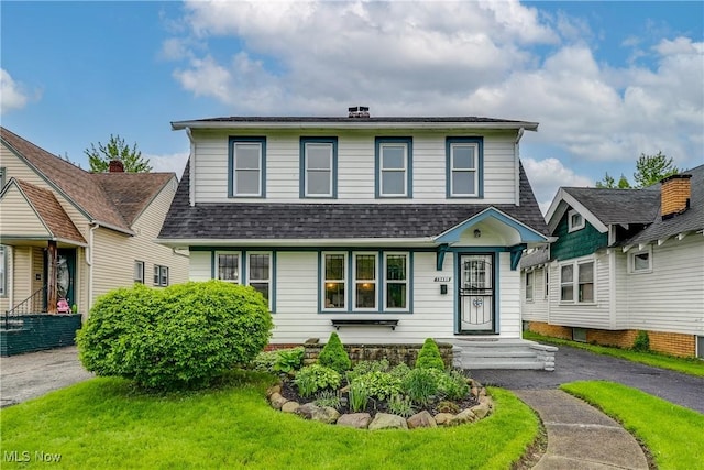 view of front of house with a shingled roof