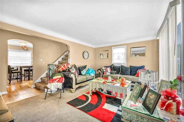 21407 Libby Rd, Maple Heights, OH 44137 - living area with arched walkways, plenty of natural light, stairway, and wood finished floors