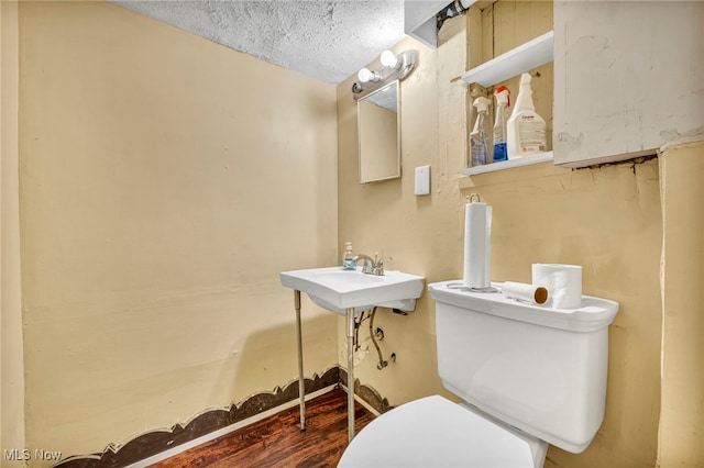 21407 Libby Rd, Maple Heights, OH 44137 - half bath with toilet, a textured ceiling, and a sink