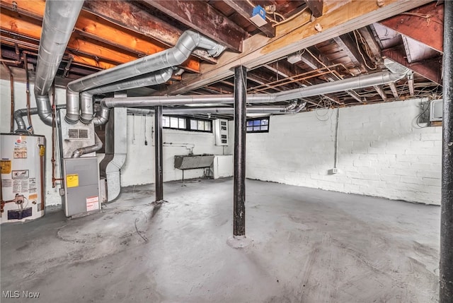 955 Dresden Rd, Cleveland Heights, OH 44112 - basement with water heater, heating unit, and a sink