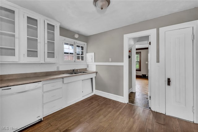 955 Dresden Rd, Cleveland Heights, OH 44112 - kitchen with dishwasher, a sink, dark wood-style floors, white cabinets, and healthy amount of natural light