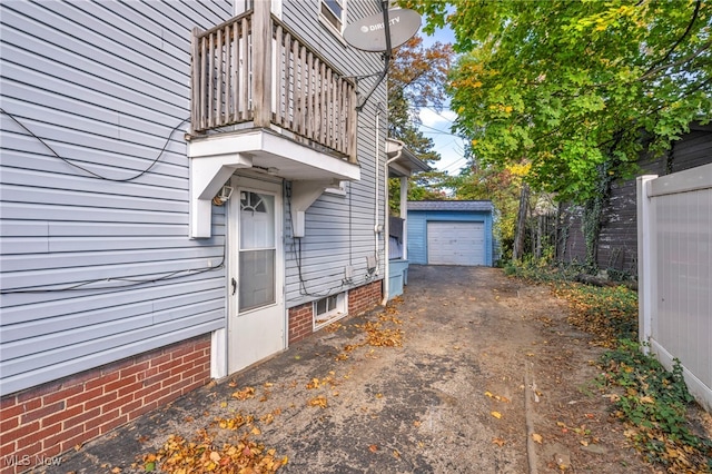 955 Dresden Rd, Cleveland Heights, OH 44112 - view of home's exterior with a balcony, asphalt driveway, and an outdoor structure