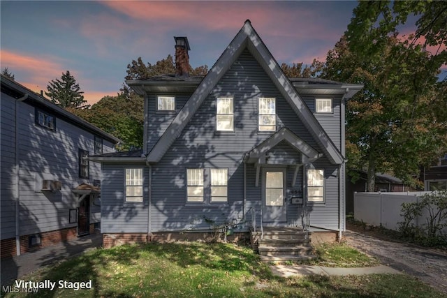 955 Dresden Rd, Cleveland Heights, OH 44112 - view of front of home with a chimney and fence
