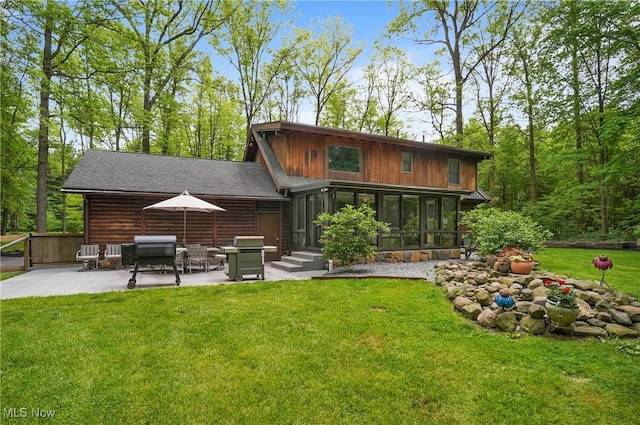 1354 N Pricetown Rd, Diamond, OH 44412 - back of property featuring a patio area, a lawn, and a sunroom