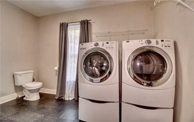 601 Short St, Dover, OH 44622 - washroom featuring washing machine and clothes dryer and baseboards