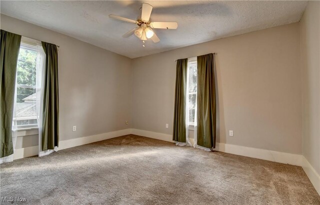 601 Short St, Dover, OH 44622 - carpeted spare room featuring a ceiling fan and baseboards