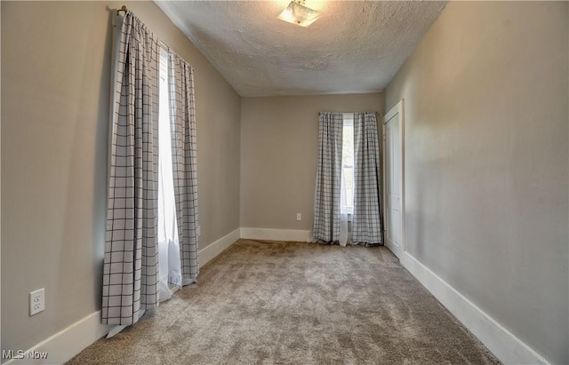 601 Short St, Dover, OH 44622 - carpeted empty room featuring a textured ceiling and baseboards