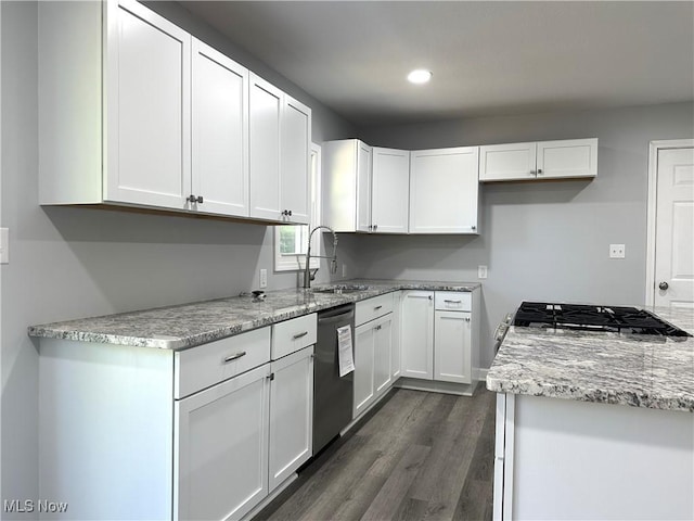 4378 Victoria Ter SE, Warren, OH 44484 - kitchen with stainless steel dishwasher, a sink, white cabinetry, dark wood-style floors, and recessed lighting
