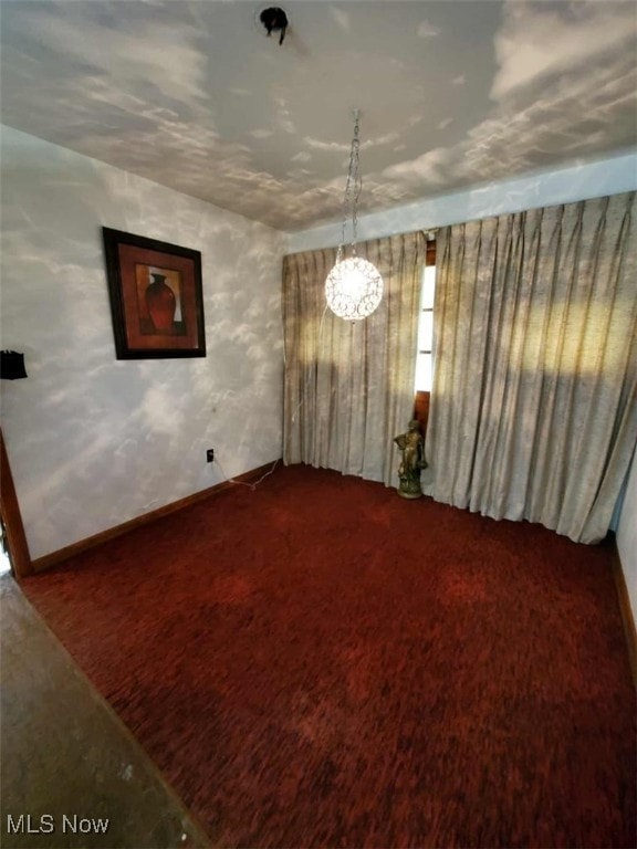 7417 Broadview Rd, Seven Hills, OH 44131 - carpeted empty room with a chandelier and baseboards