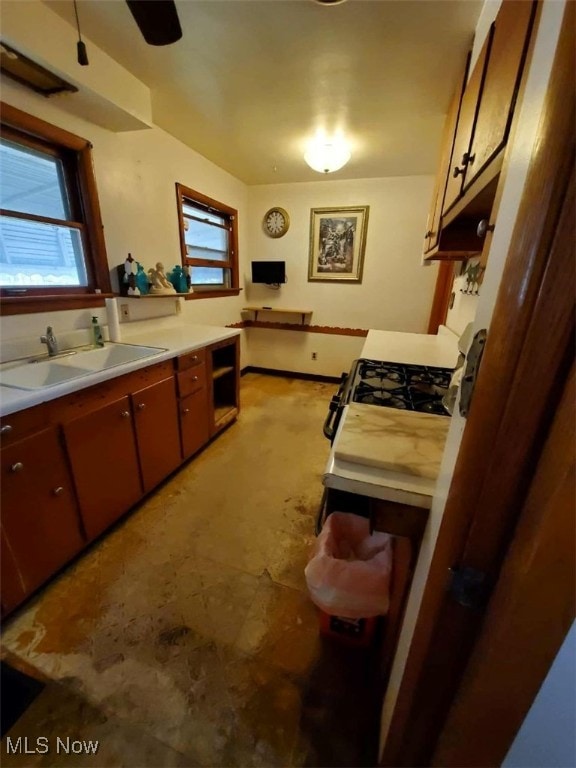 7417 Broadview Rd, Seven Hills, OH 44131 - kitchen featuring a sink, light countertops, and white gas range