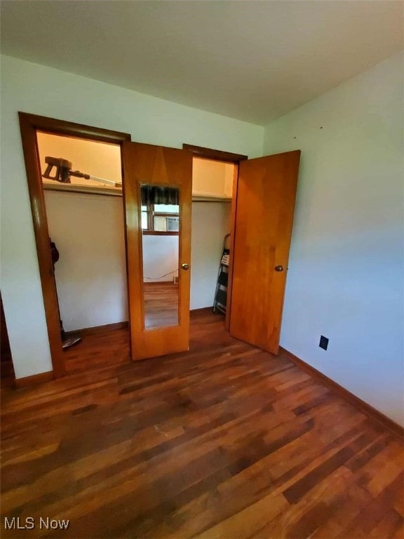 7417 Broadview Rd, Seven Hills, OH 44131 - unfurnished bedroom featuring dark wood-style flooring and baseboards