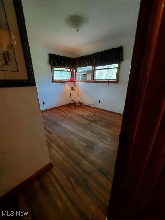 7417 Broadview Rd, Seven Hills, OH 44131 - spare room featuring wood finished floors, healthy amount of natural light, and cooling unit