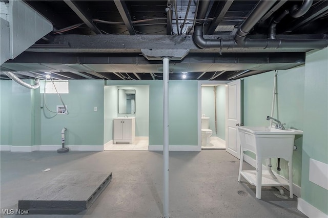 finished basement featuring baseboards