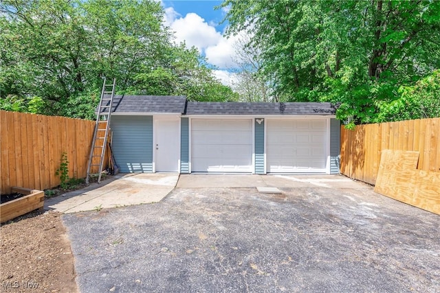 detached garage with fence