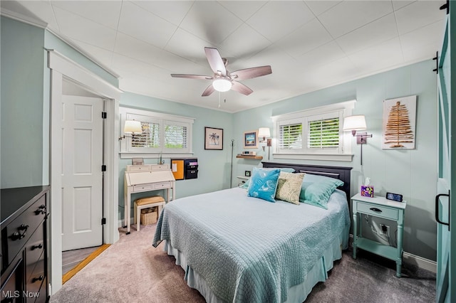 bedroom with multiple windows and ceiling fan