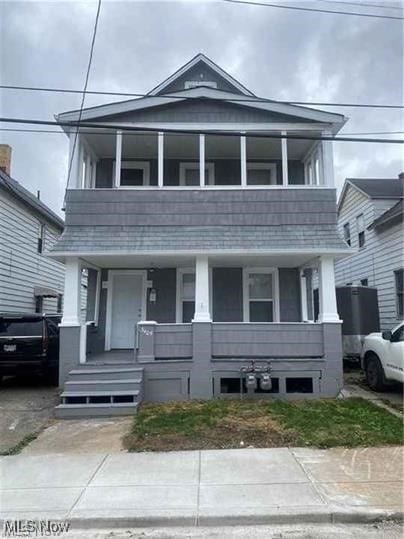 3405 Roehl Ave, Cleveland, OH 44109 - view of front of property with covered porch and a balcony