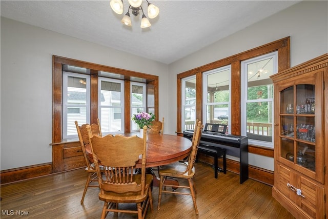 2534 6th St, Cuyahoga Falls, OH 44221 - dining room with a chandelier, wood finished floors, and baseboards