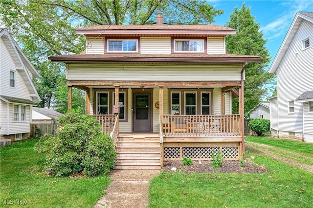 2534 6th St, Cuyahoga Falls, OH 44221 - view of front of home featuring a porch and a front yard