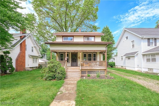 2534 6th St, Cuyahoga Falls, OH 44221 - view of front of house featuring a porch and a front yard