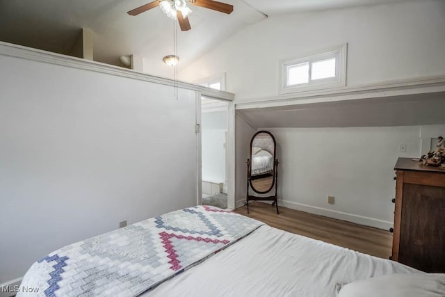 6319 Columbus Rd NE, Louisville, OH 44641 - bedroom with vaulted ceiling, wood finished floors, baseboards, and a ceiling fan