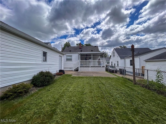 view of yard featuring a patio area and a deck