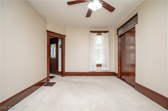 390 E Clark St, East Palestine, OH 44413 - unfurnished bedroom featuring carpet flooring, baseboards, and a ceiling fan