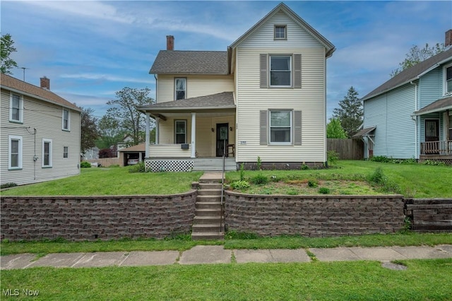 390 E Clark St, East Palestine, OH 44413 - view of front facade featuring a porch, a front yard, and a chimney