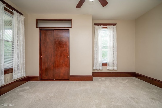 390 E Clark St, East Palestine, OH 44413 - unfurnished bedroom with carpet, baseboards, and ceiling fan