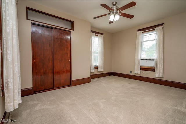 390 E Clark St, East Palestine, OH 44413 - unfurnished bedroom with multiple windows, carpet, baseboards, and ceiling fan