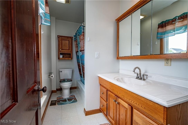 390 E Clark St, East Palestine, OH 44413 - full bathroom with tile patterned floors, toilet, vanity, shower / bathtub combination with curtain, and baseboards