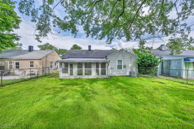 1212 Eastwood Ave, Mayfield Heights, OH 44124 - back of property featuring a sunroom and central air condition unit