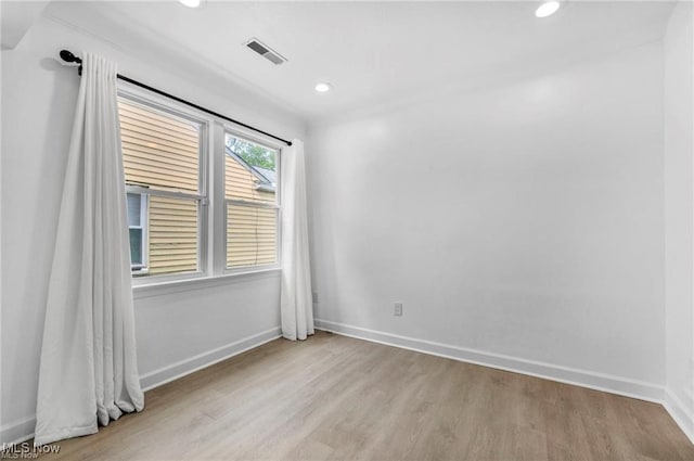 1212 Eastwood Ave, Mayfield Heights, OH 44124 - empty room featuring wood finished floors, baseboards, and recessed lighting