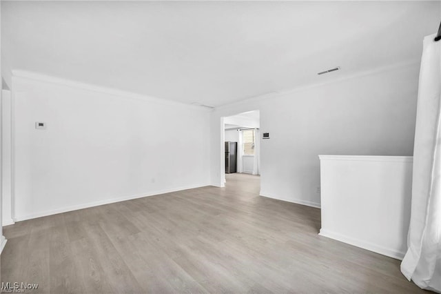 1212 Eastwood Ave, Mayfield Heights, OH 44124 - unfurnished room with wood finished floors and baseboards