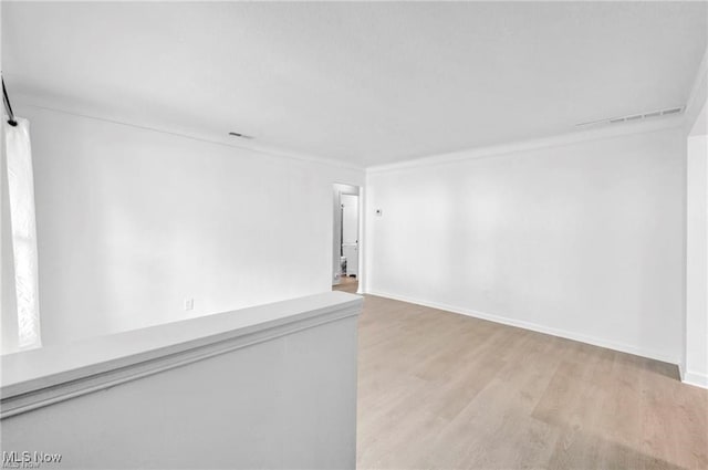 1212 Eastwood Ave, Mayfield Heights, OH 44124 - unfurnished room with light wood-style flooring and baseboards