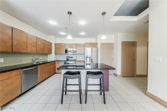 2030 Euclid Ave Unit 201, Cleveland, OH 44115 - kitchen featuring stainless steel appliances, backsplash, baseboards, and a kitchen bar