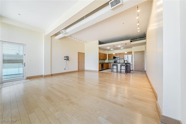 2030 Euclid Ave Unit 201, Cleveland, OH 44115 - unfurnished living room with light wood-type flooring and baseboards