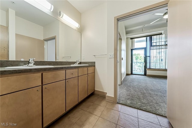 2030 Euclid Ave Unit 201, Cleveland, OH 44115 - full bath featuring tile patterned flooring, baseboards, double vanity, and a ceiling fan