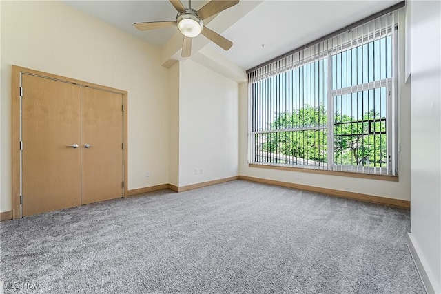 2030 Euclid Ave Unit 201, Cleveland, OH 44115 - unfurnished bedroom featuring carpet, baseboards, vaulted ceiling, and a ceiling fan