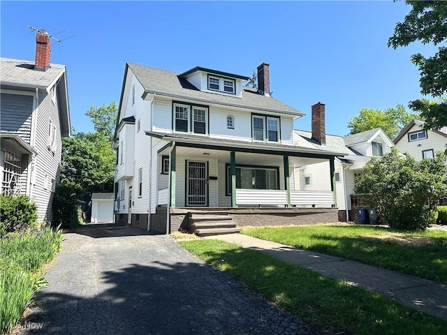 3277 Cedarbrook Rd, Cleveland Heights, OH 44118 - traditional style home featuring covered porch, a chimney, cooling unit, and a detached garage