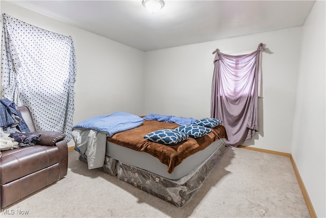 carpeted bedroom with baseboards