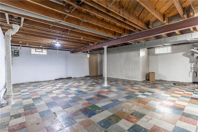 basement with tile patterned floors and gas meter