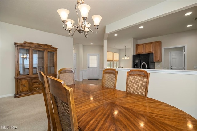 dining area featuring a chandelier, recessed lighting, and baseboards