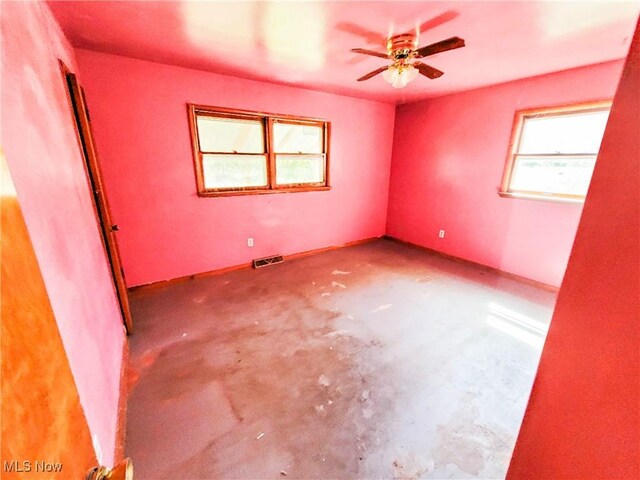 16251 State Route 678, Rockbridge, OH 43149 - empty room featuring unfinished concrete floors and a ceiling fan