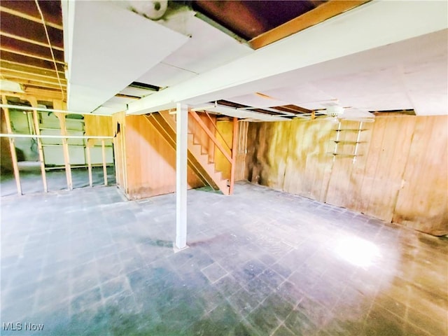 16251 State Route 678, Rockbridge, OH 43149 - unfinished basement featuring wood walls, stairs, and tile patterned floors